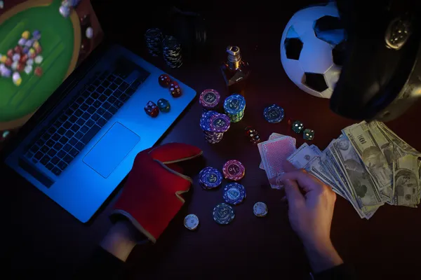 A glowing roulette wheel with cascading chips, symbolizing the engaging live and instant-win games available on ZBZBET.