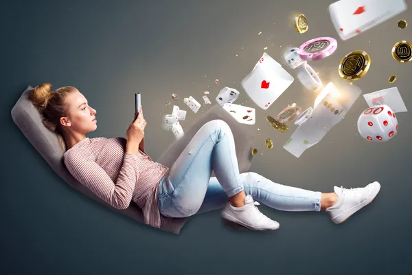 A player using their smartphone during a festive local event, representing ZBZBET’s fully mobile-friendly casino.